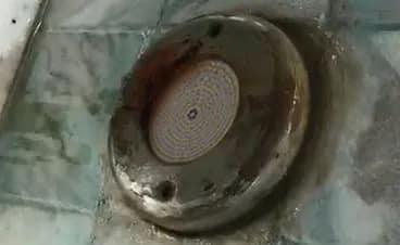 Rusty stainless steel pool light